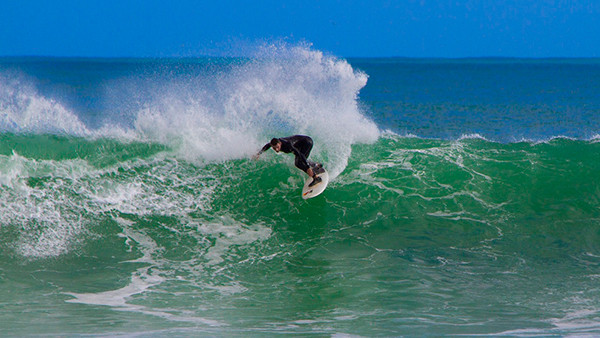 Ewan Ross surfing