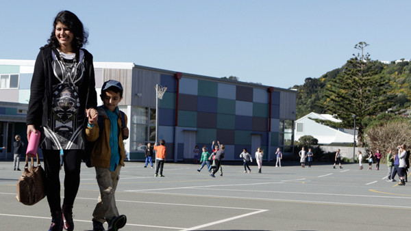 Migrant family looking at New Zealand schools